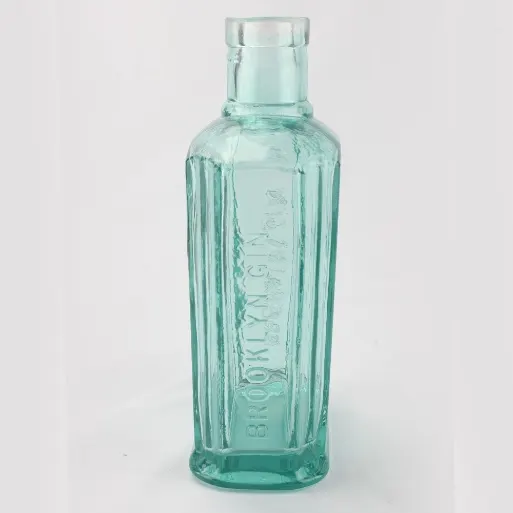 Brush-in-cap closure components for small glass glue bottles including stems brushes and wiper inserts