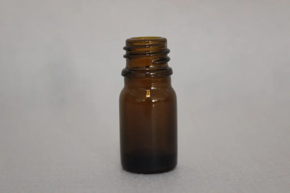 Blue, green, amber and clear glass bottles for essential oil and cosmetic use — colour range produced by Optimizing Glass Bottle