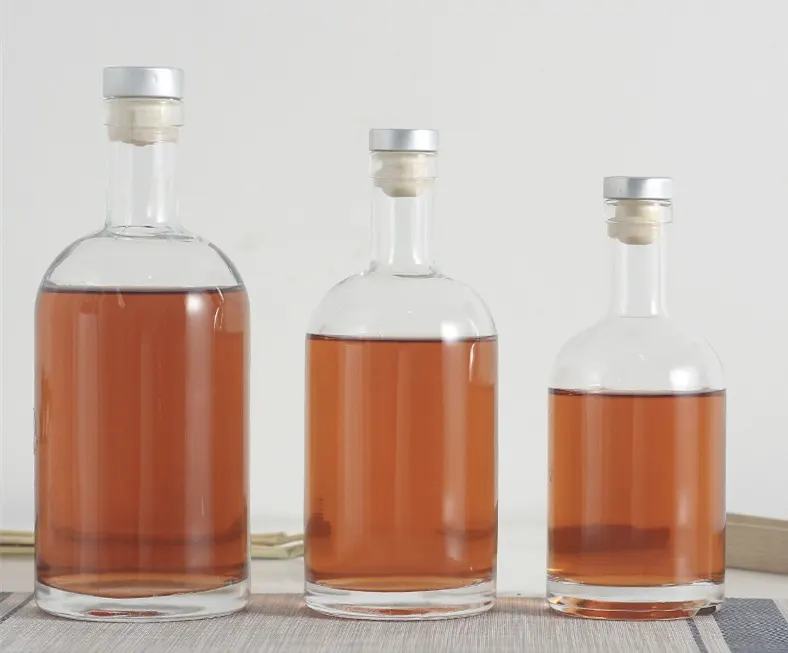 Decorative liqueur bottles with frosted finish embossing and sprayed colors