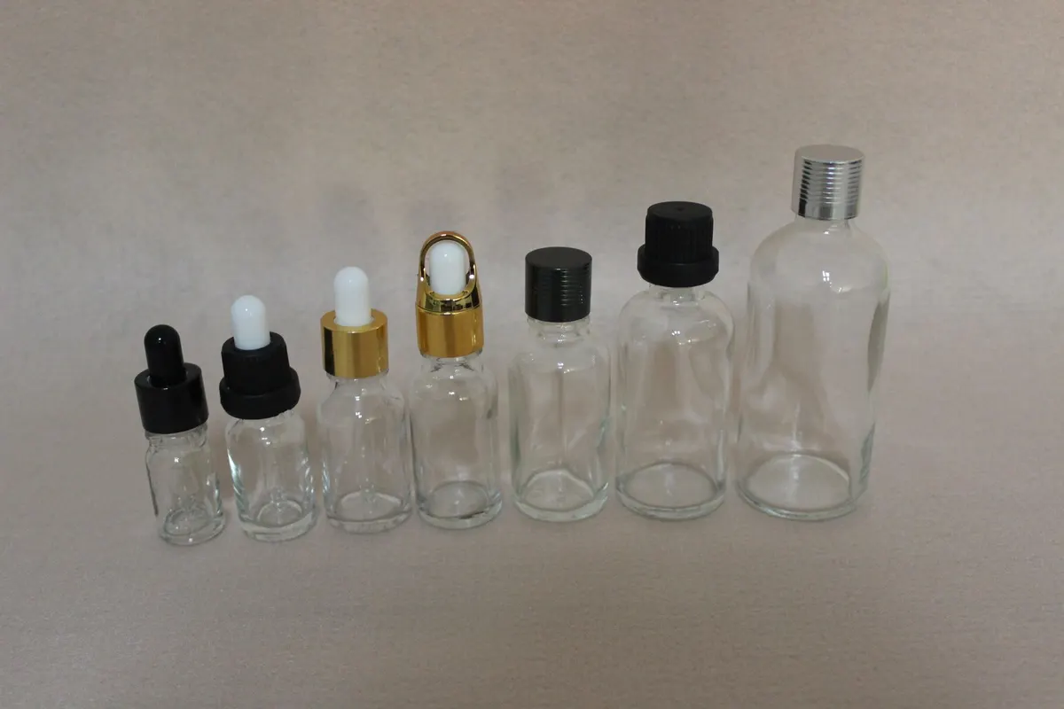 amber glass spray bottles with matched closures ready for filling lines