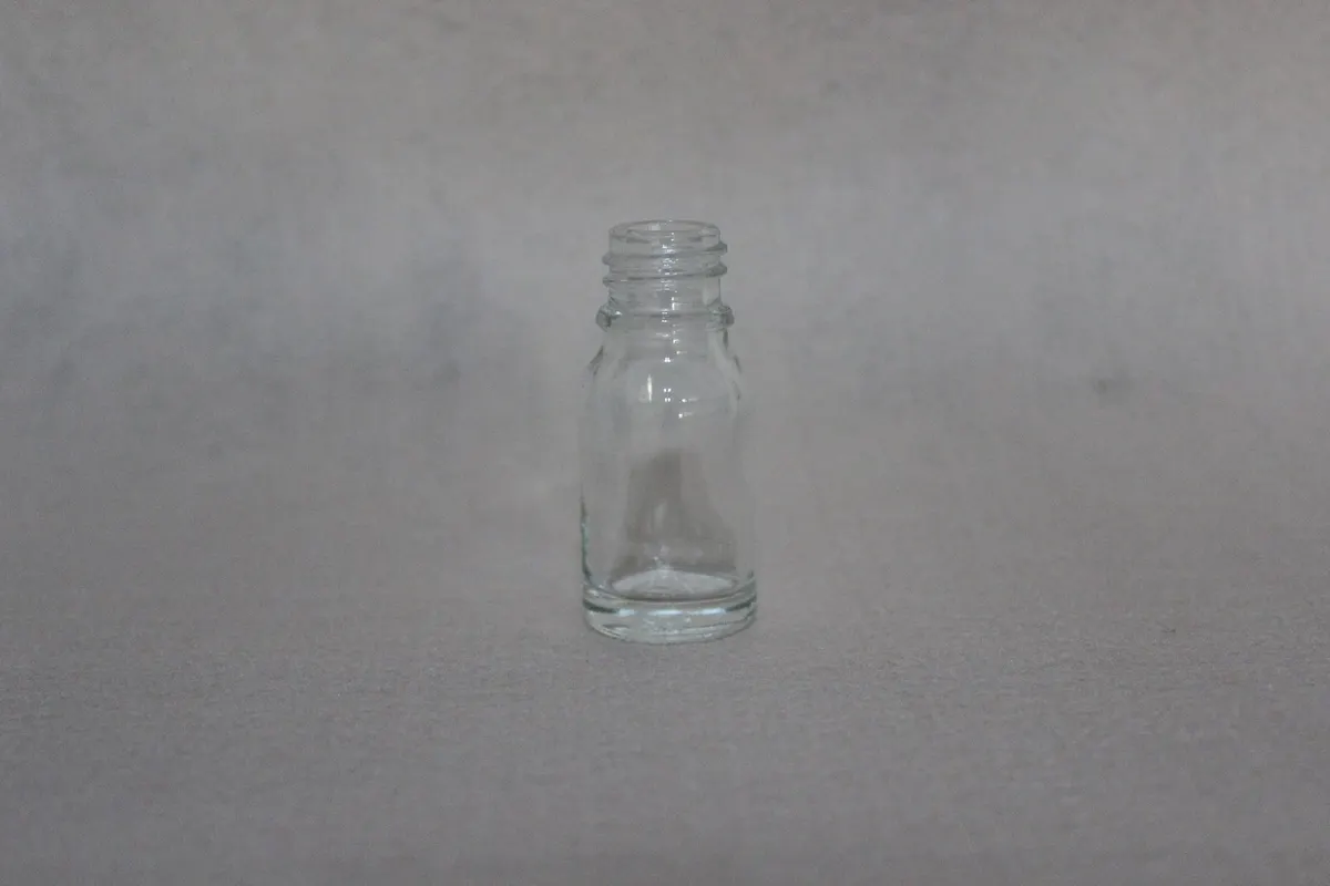 blue essential oil bottles with matched closures ready for filling lines