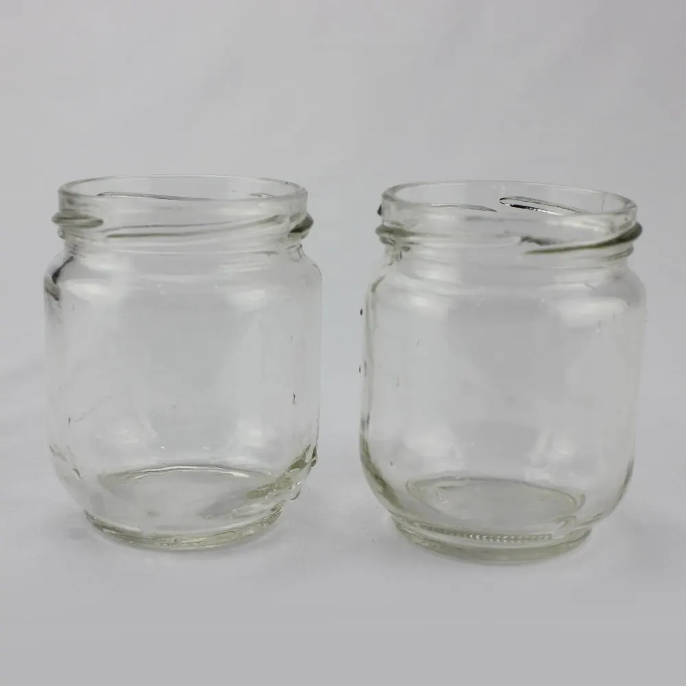 frosted glass jars with matched closures ready for filling lines