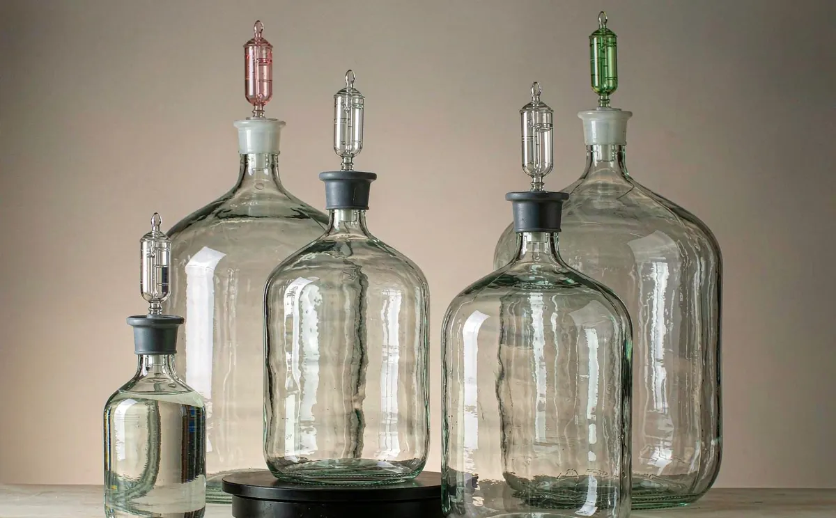 Clear glass carboys in five sizes with airlocks and stoppers