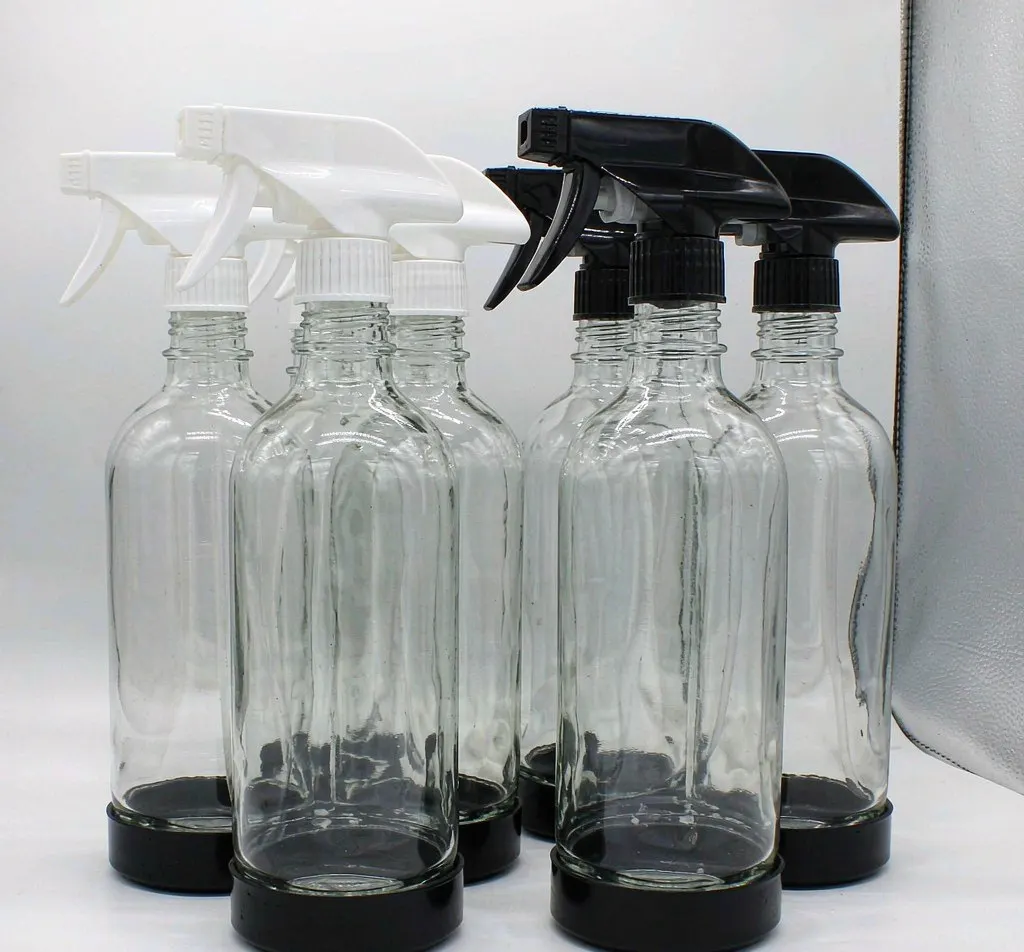 Clear glass trigger spray bottles with white and black sprayer heads