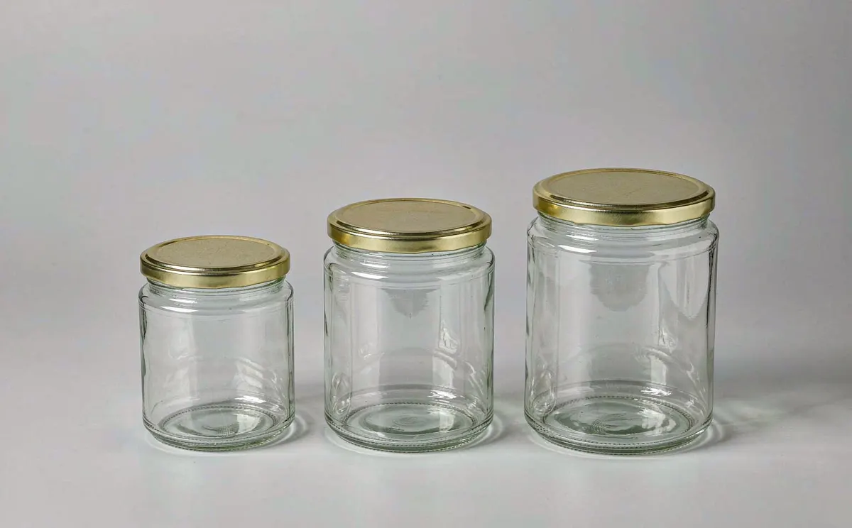 Clear wide-mouth glass salsa jars with gold lug lids in three sizes