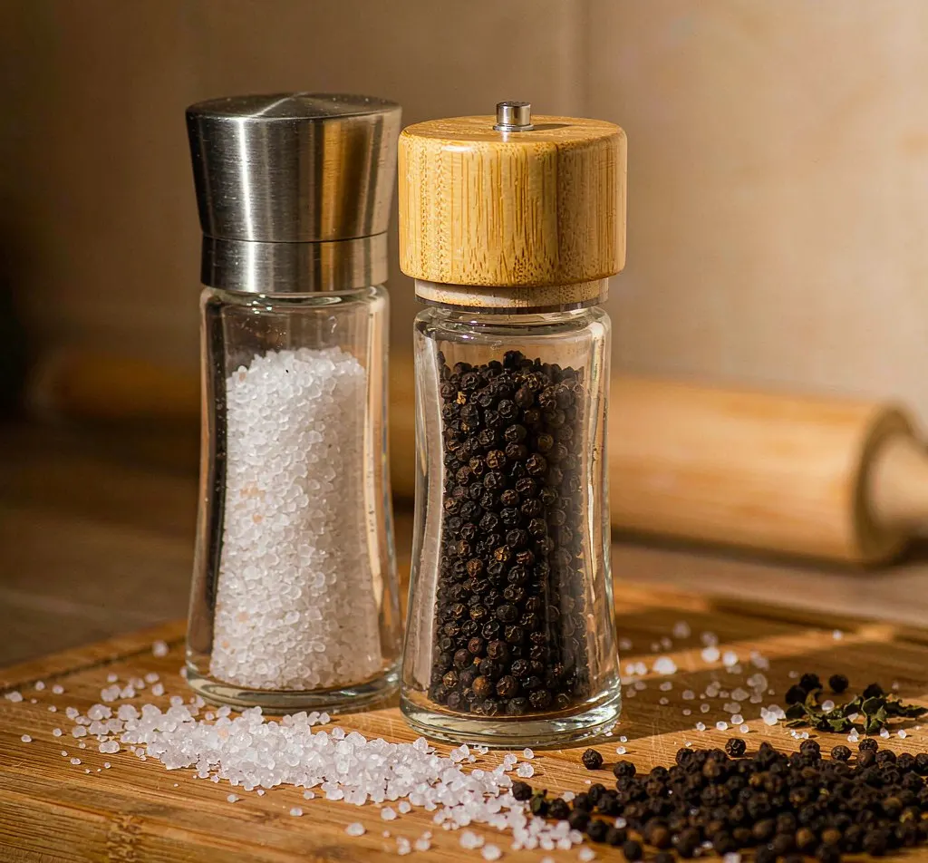 Glass salt and pepper grinder bottles with steel and bamboo lids