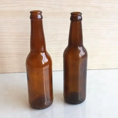 amber vs clear glass bottles with matched closures ready for filling lines
