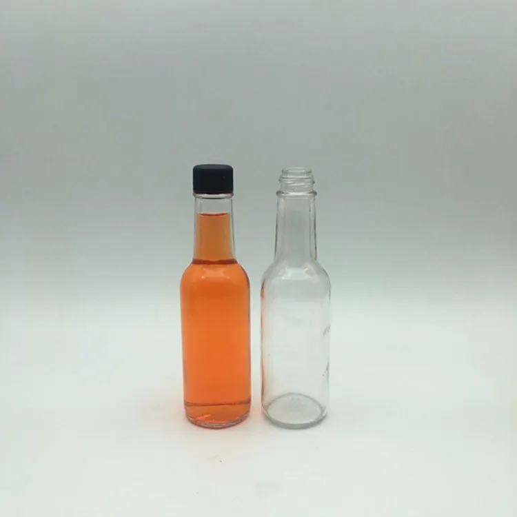 container loading glass bottles with matched closures ready for filling lines