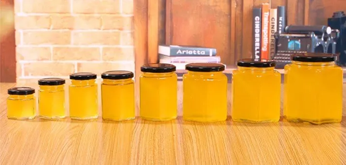labeling machine glass bottles with matched closures ready for filling lines