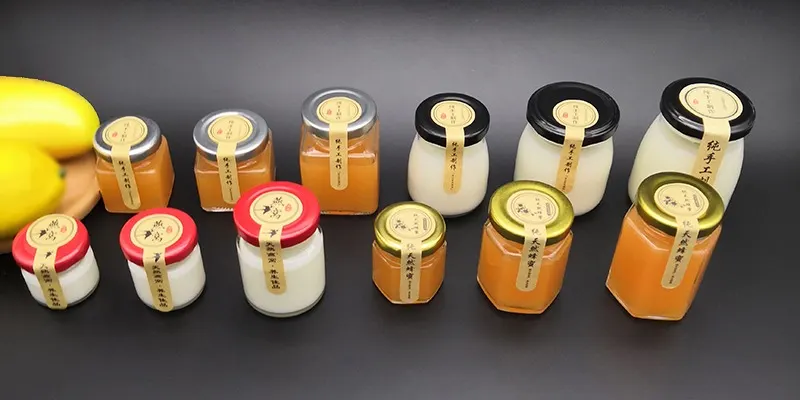 Forklift loading shrink wrapped pallets of mason jars into a shipping container