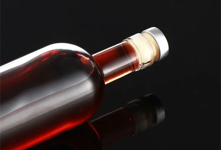 Whiskey bottle technical drawing with capacity, weight, and neck finish callouts